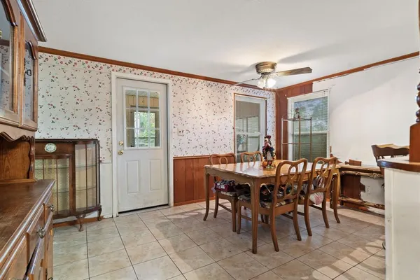 a view of a dining room with furniture and window