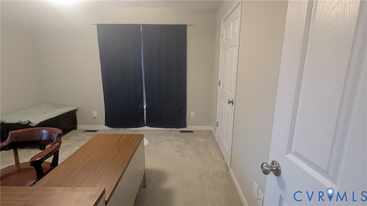 24580 St James Road Jetersville, VA 23083 - Photo 19 of 48 Neutral-toned room featuring light beige carpeting