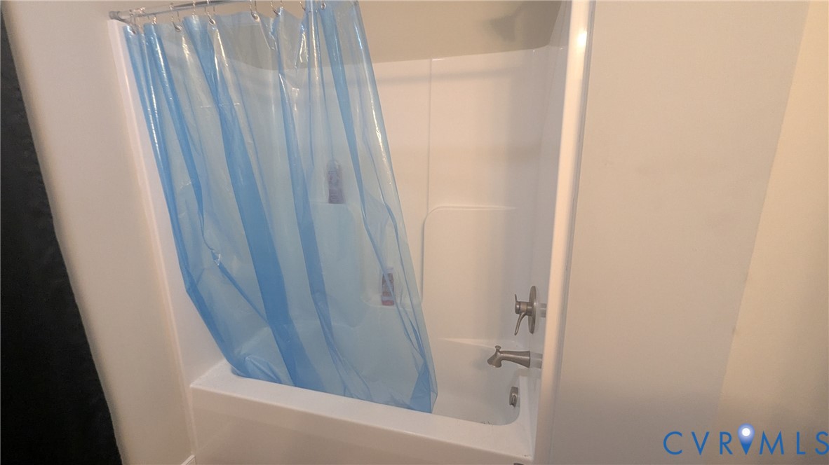 24580 St James Road Jetersville, VA 23083 - Photo 33 of 48 White tub and shower combination with brushed nick
