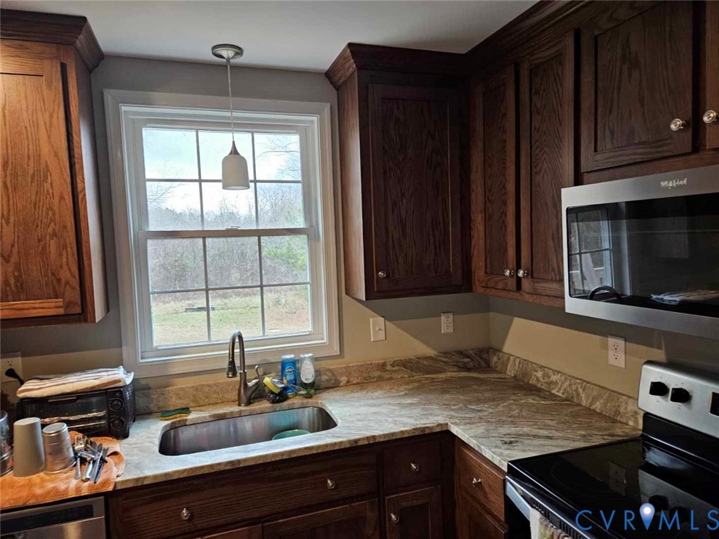 24580 St James Road Jetersville, VA 23083 - Photo 6 of 48 Kitchen featuring wood cabinetry, stainless steel