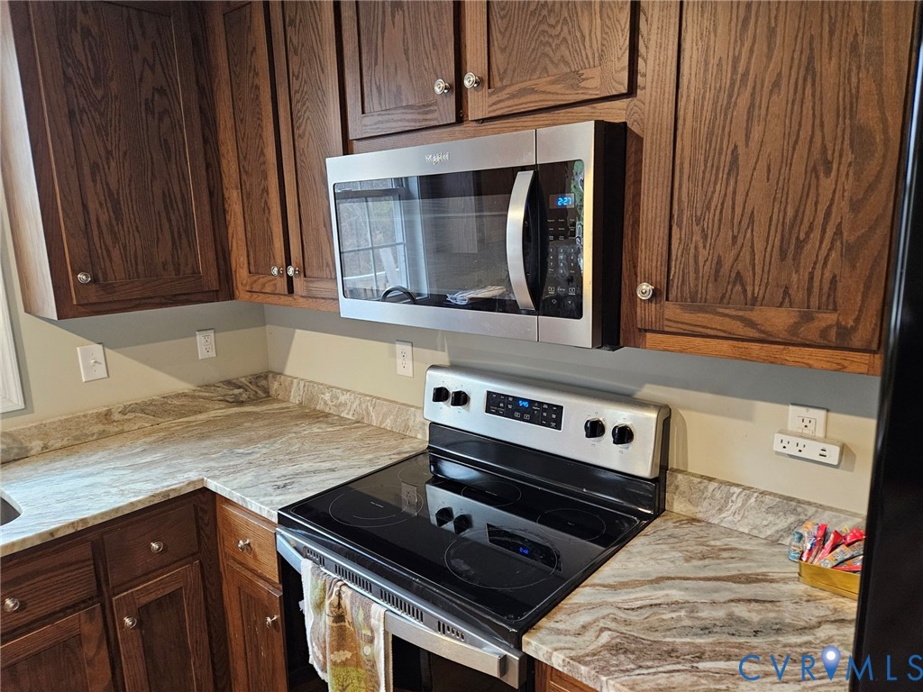 24580 St James Road Jetersville, VA 23083 - Photo 7 of 48 Kitchen featuring wood-finish cabinetry, stainless