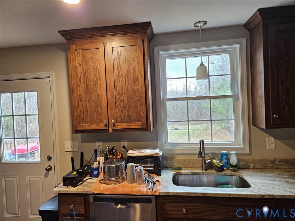 24580 St James Road Jetersville, VA 23083 - Photo 9 of 48 Kitchen featuring wood cabinetry, stone-finish cou