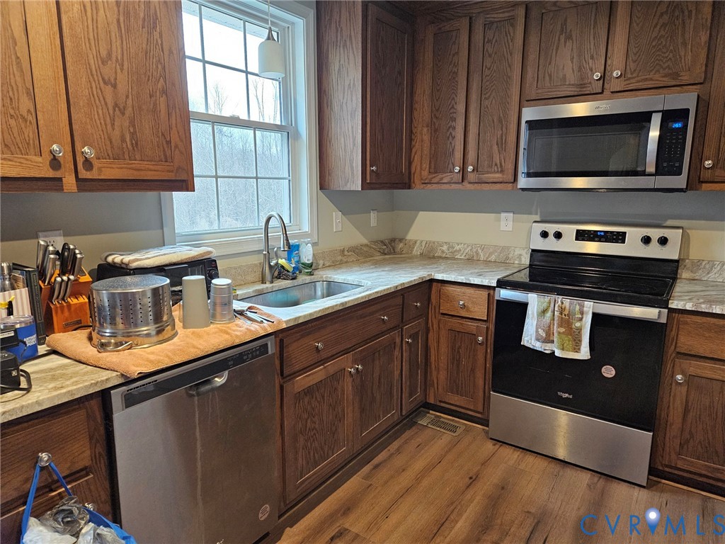 24580 St James Road Jetersville, VA 23083 - Photo 10 of 48 Kitchen featuring wood-finish cabinetry, light-ton
