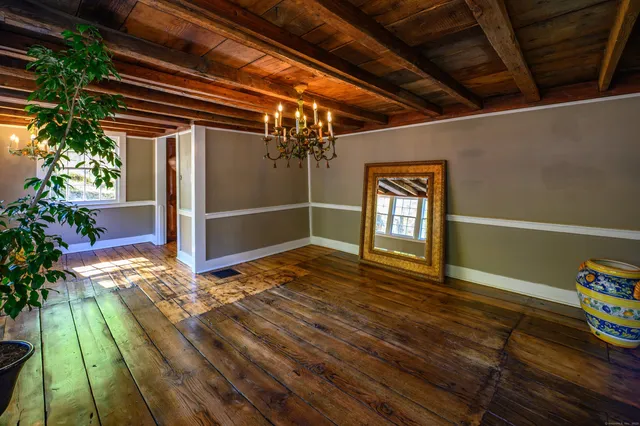 a view of an entryway door with wooden floor