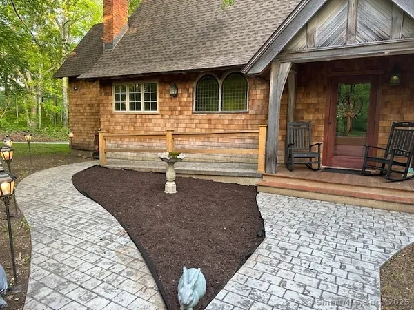 a front view of a house with garden