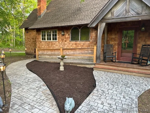 a front view of a house with garden