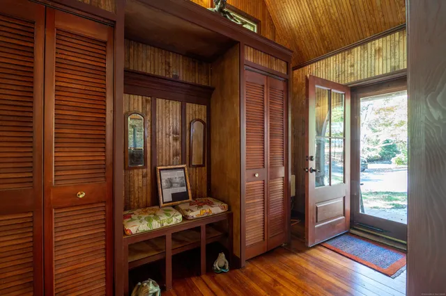 a backyard of a house with barbeque oven table and chairs