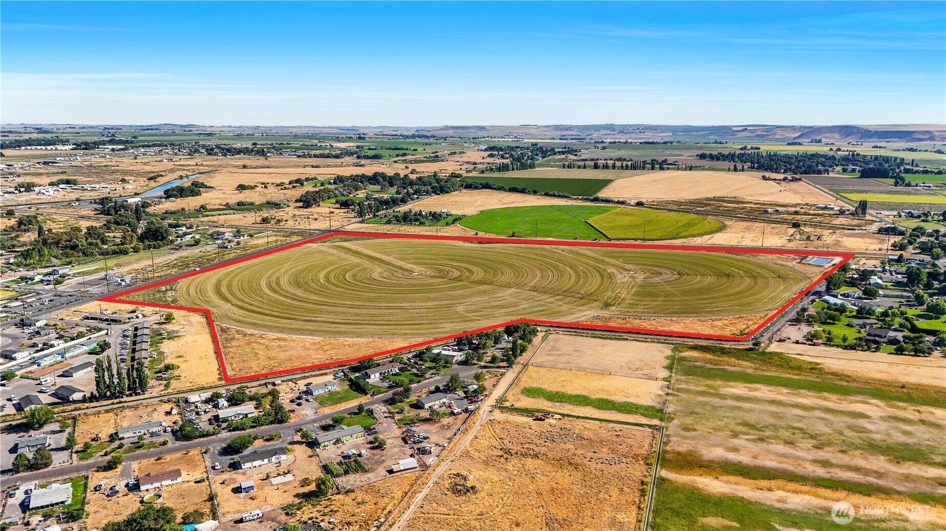 -na South Taylor Road Othello, WA 99344 - Photo 2 of 8 an aerial view of residential houses with outdoor space
