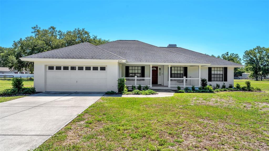 8525 North Campbell Road Lakeland, FL 33810 - Photo 1 of 45 a front view of a house with garden