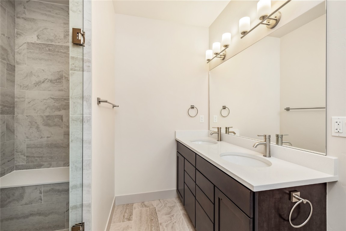 628 Montezuma Road, Unit D1 Keystone, CO 80435 - Photo 12 of 29 a bathroom with a sink vanity and a mirror