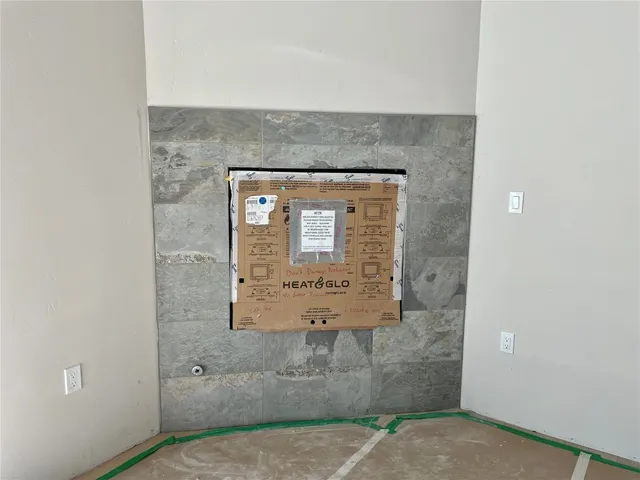 a utility room with cabinets washer and dryer