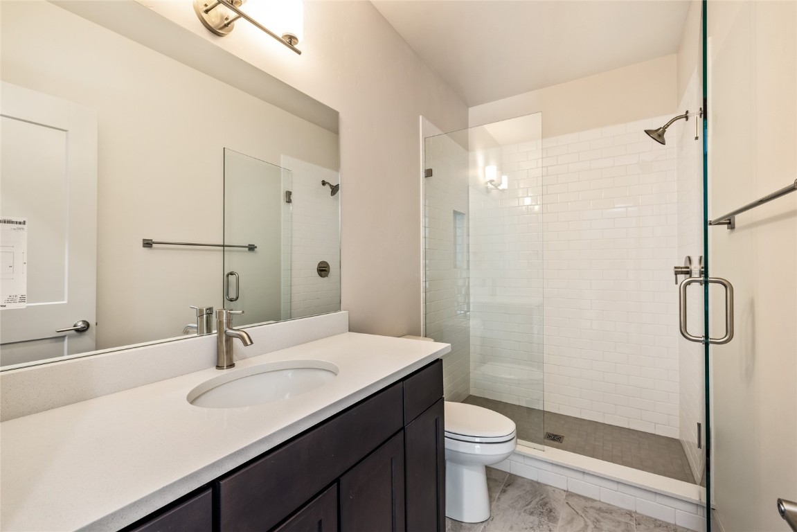 628 Montezuma Road, Unit D1 Keystone, CO 80435 - Photo 16 of 29 a bathroom with a granite countertop sink toilet and shower