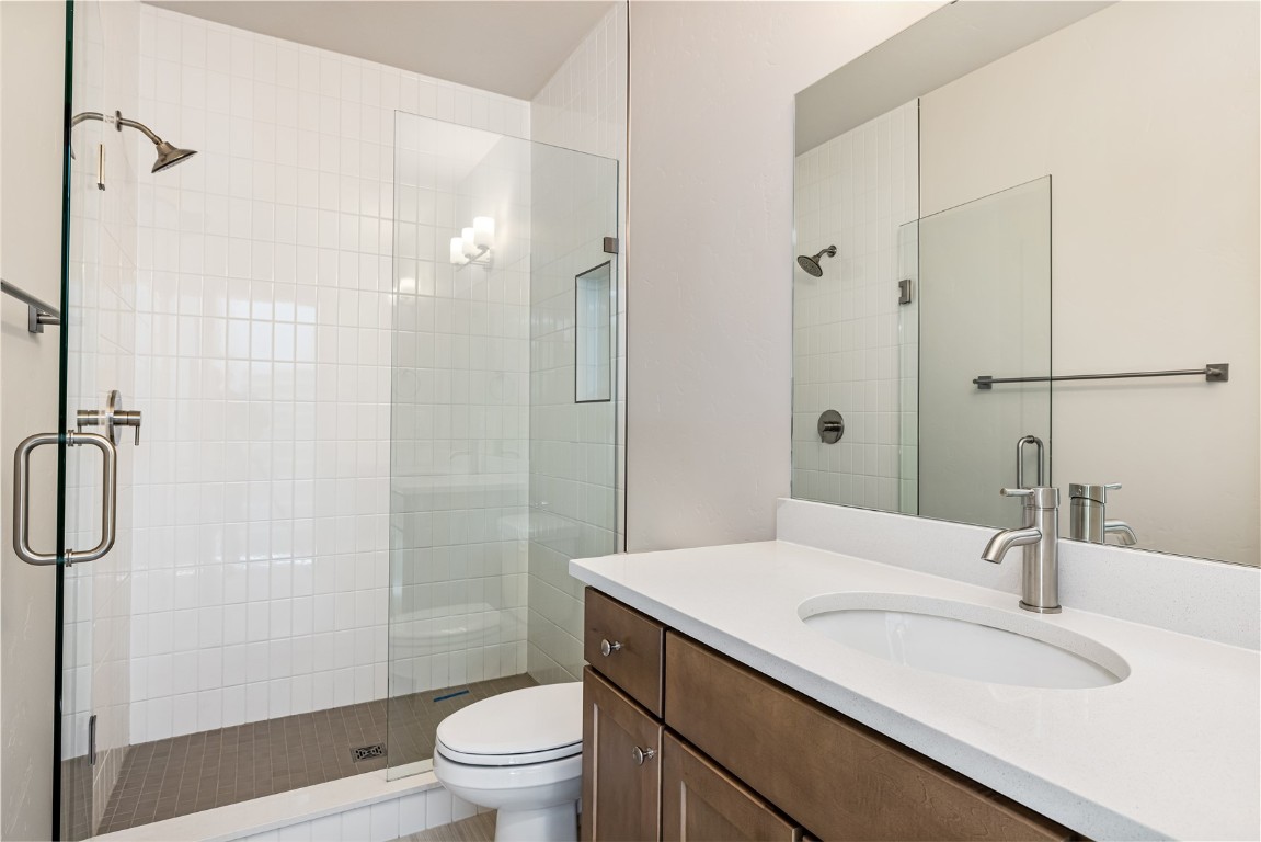 628 Montezuma Road, Unit D1 Keystone, CO 80435 - Photo 18 of 31 a bathroom with a sink a toilet and shower