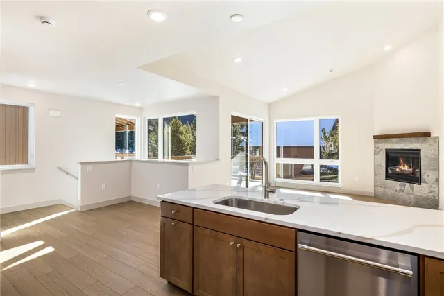 a kitchen with counter top space and windows