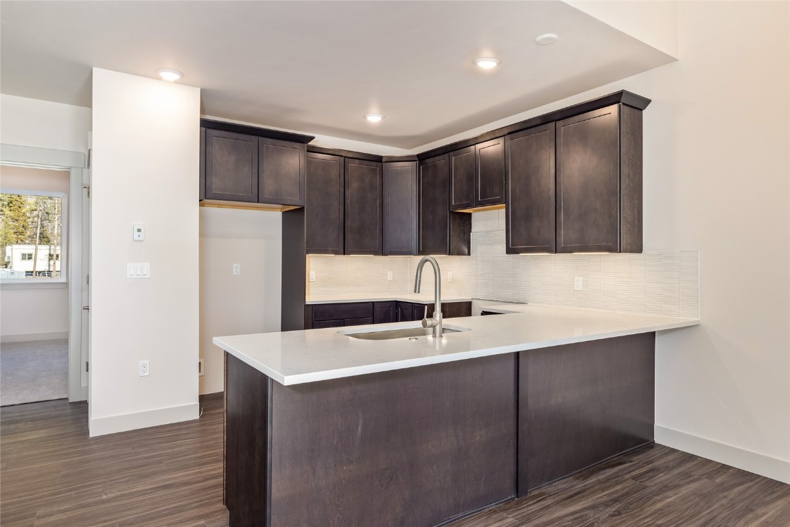 628 Montezuma Road, Unit D1 Keystone, CO 80435 - Photo 7 of 29 a kitchen with kitchen island a sink stainless steel appliances and cabinets