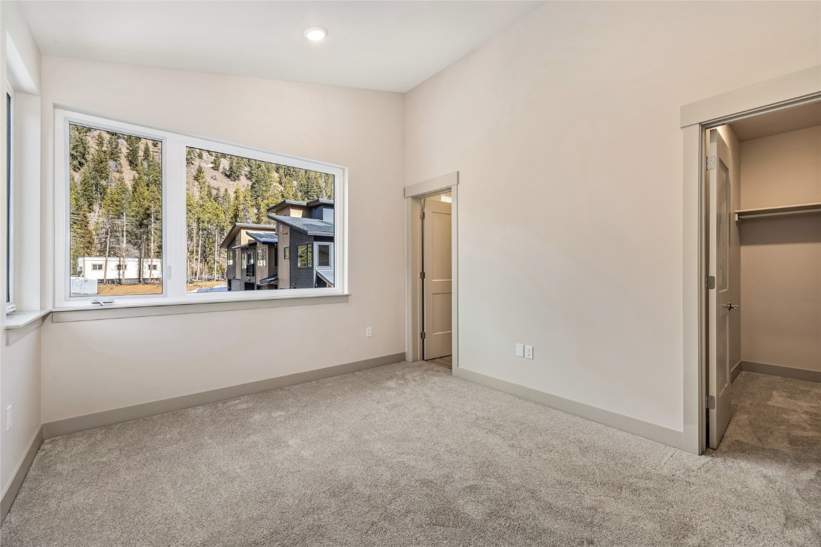 628 Montezuma Road, Unit D1 Keystone, CO 80435 - Photo 10 of 29 an empty room with windows and closet