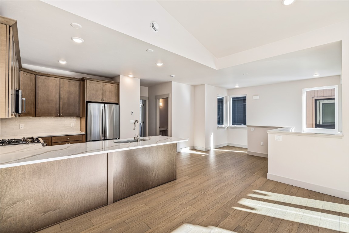 628 Montezuma Road, Unit D1 Keystone, CO 80435 - Photo 10 of 31 a large hall with stainless steel appliances granite countertop a refrigerator and a sink