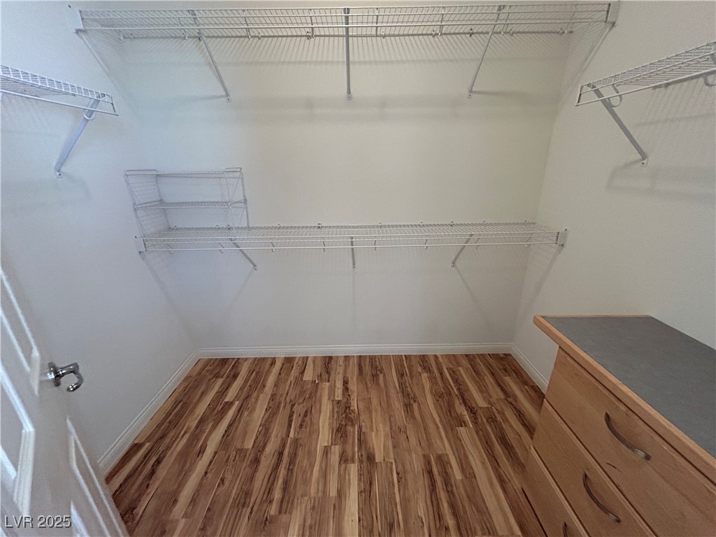 5553 Fairmeade Way Las Vegas, NV 89135 - Photo 27 of 42 Walk in closet with light wood finished floors
