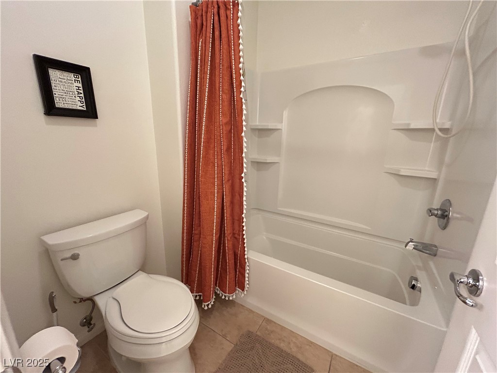 5553 Fairmeade Way Las Vegas, NV 89135 - Photo 29 of 42 Full bathroom with light tile patterned floors and shower / bath combo with shower curtain