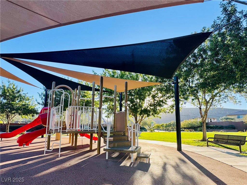 5553 Fairmeade Way Las Vegas, NV 89135 - Photo 41 of 42 Community jungle gym featuring a lawn
