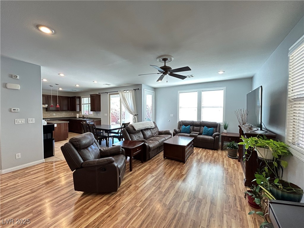 5553 Fairmeade Way Las Vegas, NV 89135 - Photo 5 of 42 Living area with plenty of natural light, light wood-style floors, ceiling fan, and recessed lighting