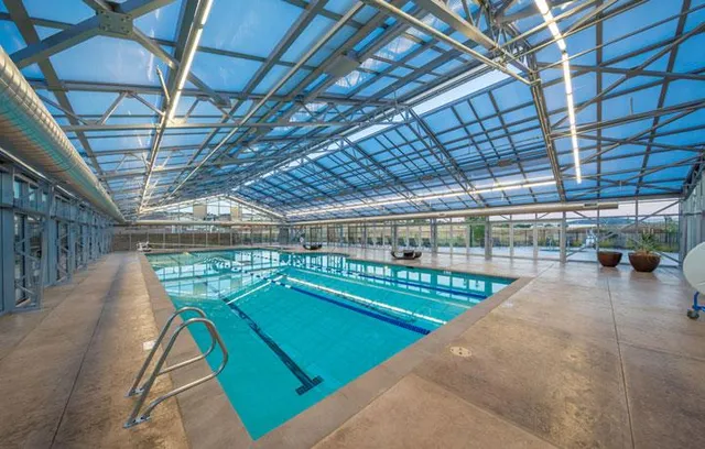 a view of a swimming pool with a garage