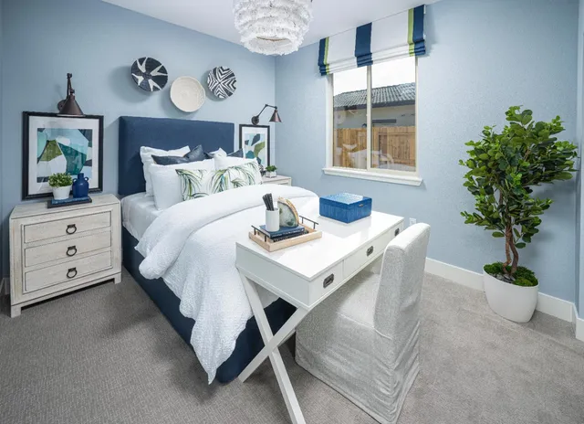 a bed room with a bed and a table