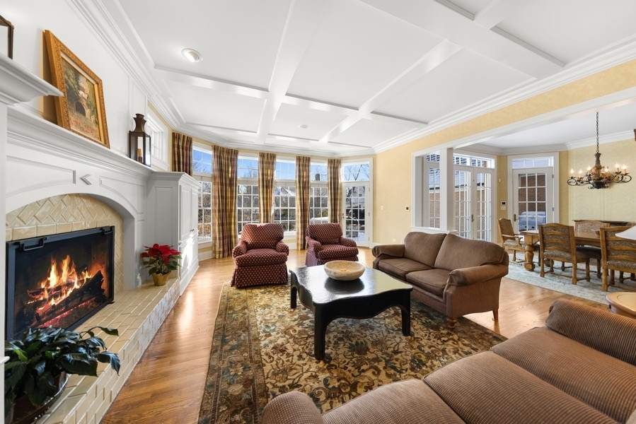 711 South County Line Road Hinsdale, IL 60521 - Photo 12 of 42 a living room with furniture fireplace and potted plants