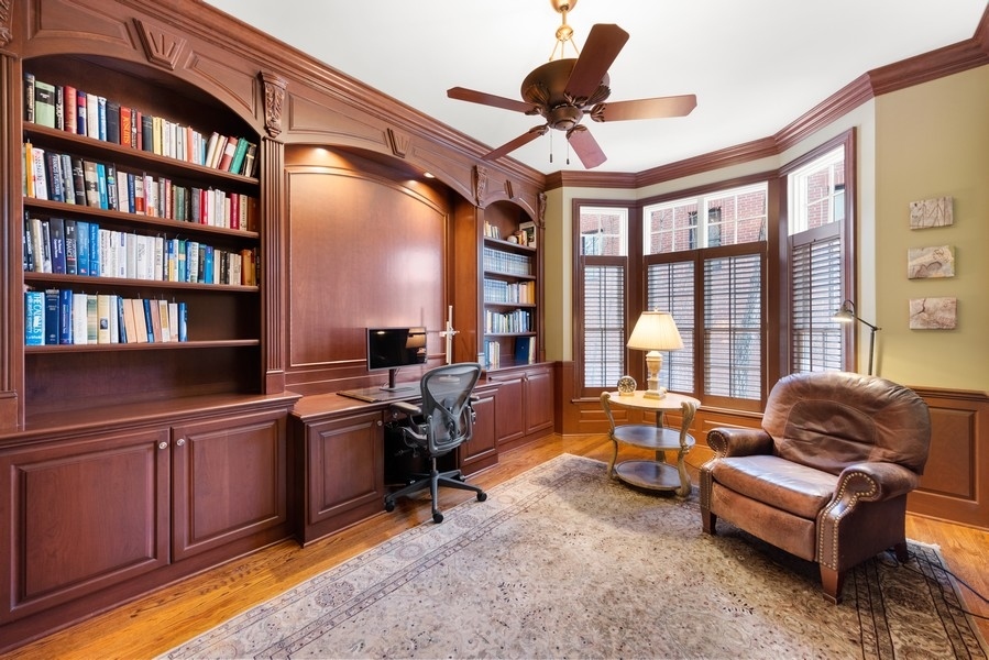 711 South County Line Road Hinsdale, IL 60521 - Photo 13 of 42 a work room with furniture wooden floor and a book shelf