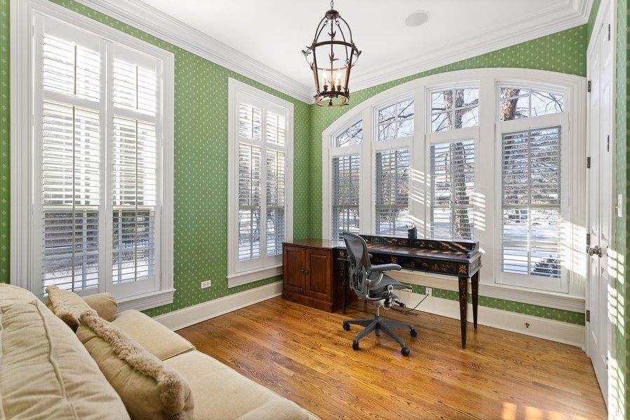 711 South County Line Road Hinsdale, IL 60521 - Photo 14 of 42 a bedroom with furniture and a window