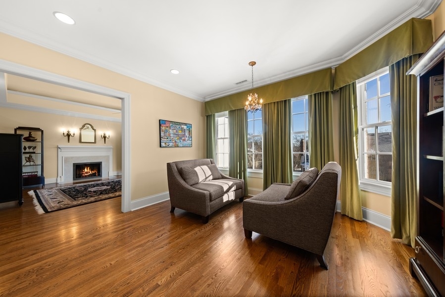 711 South County Line Road Hinsdale, IL 60521 - Photo 19 of 42 a living room with furniture and a fireplace