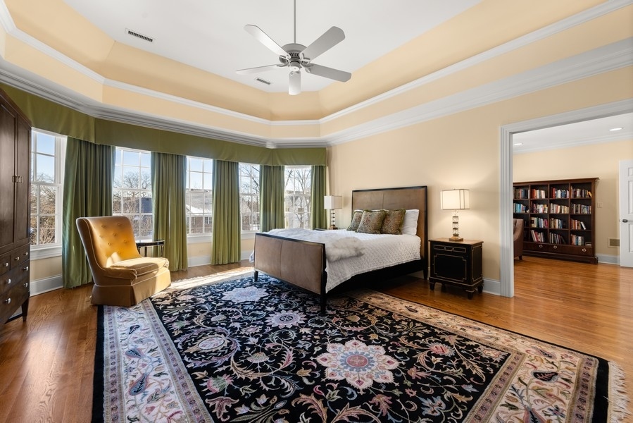 711 South County Line Road Hinsdale, IL 60521 - Photo 20 of 42 a bedroom with a large bed and a couch