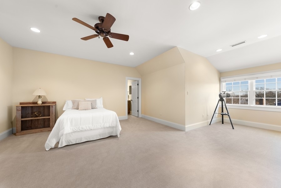 711 South County Line Road Hinsdale, IL 60521 - Photo 29 of 42 a living room with furniture and a chandelier