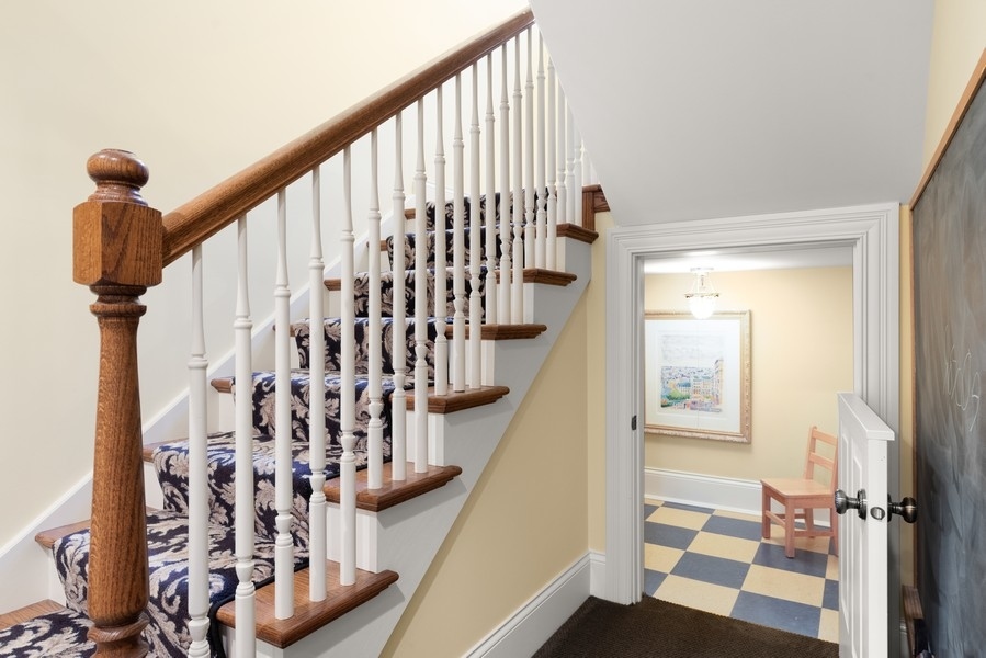 711 South County Line Road Hinsdale, IL 60521 - Photo 31 of 42 a view of entryway with wooden floor and stairs