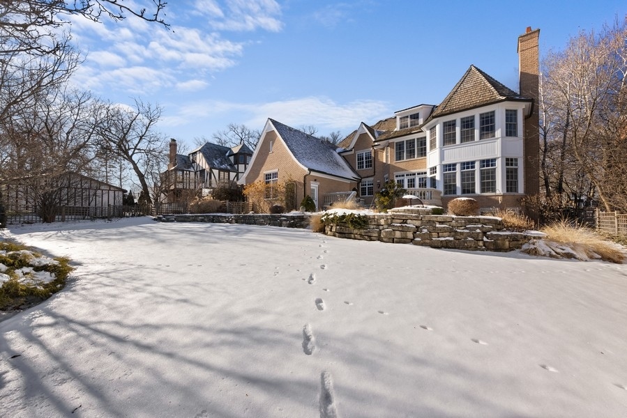 711 South County Line Road Hinsdale, IL 60521 - Photo 39 of 42 a front view of a house with a yard