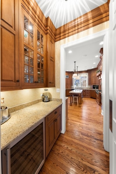 711 South County Line Road Hinsdale, IL 60521 - Photo 7 of 42 a kitchen with stainless steel appliances granite countertop a sink and a wooden cabinets