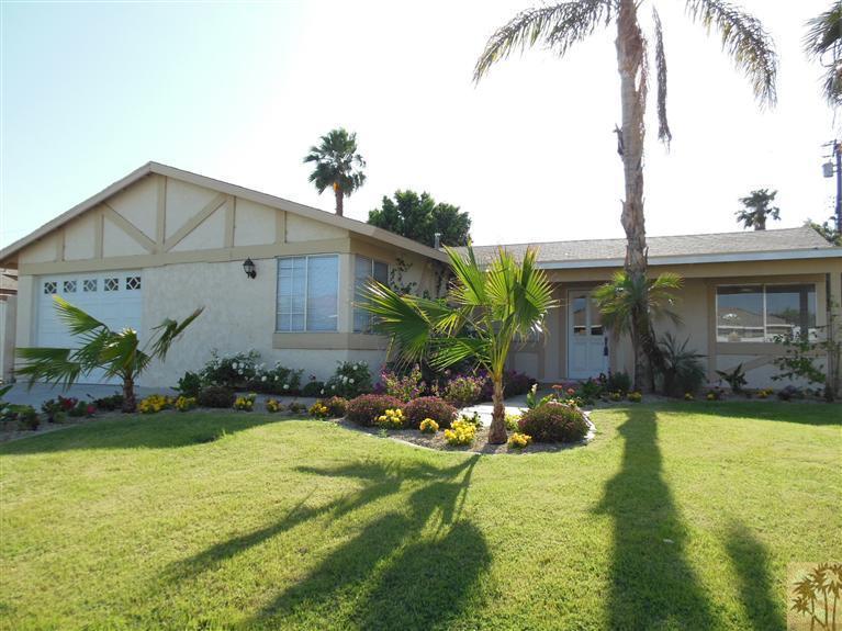 41625 Lima Hall Road Bermuda Dunes, CA 92203 - Photo 1 of 14 a front view of house with yard and green space
