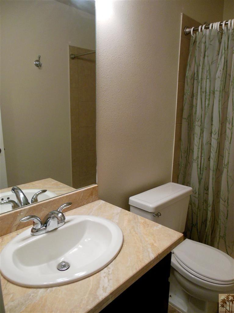 41625 Lima Hall Road Bermuda Dunes, CA 92203 - Photo 12 of 14 a bathroom with a sink and a toilet