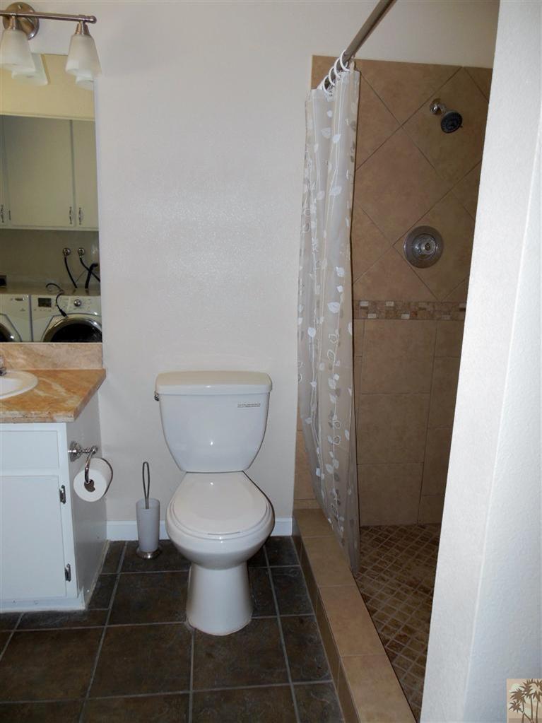 41625 Lima Hall Road Bermuda Dunes, CA 92203 - Photo 14 of 14 a bathroom with a toilet and a shower