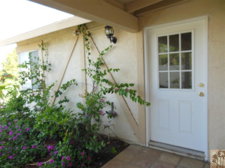 41625 Lima Hall Road Bermuda Dunes, CA 92203 - Photo 2 of 14 a house with a flower garden