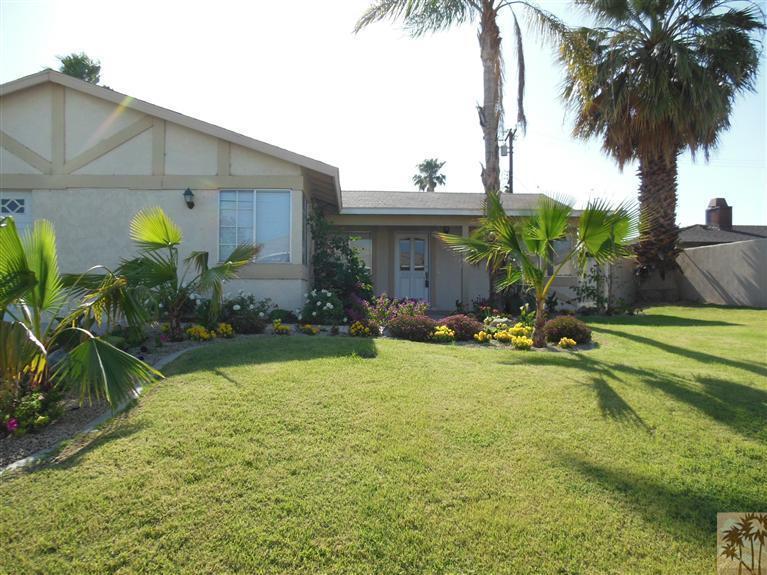 41625 Lima Hall Road Bermuda Dunes, CA 92203 - Photo 3 of 14 a front view of a house with garden