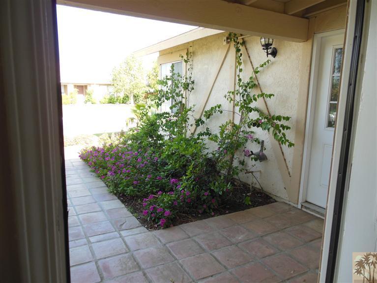 41625 Lima Hall Road Bermuda Dunes, CA 92203 - Photo 4 of 14 a view of a back yard from a corridor