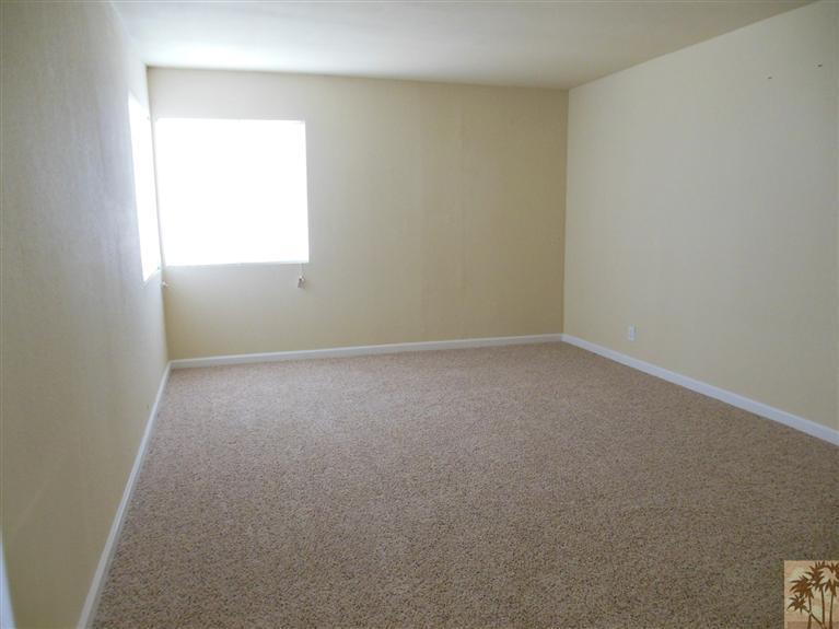 41625 Lima Hall Road Bermuda Dunes, CA 92203 - Photo 5 of 14 a view of an empty room with a window