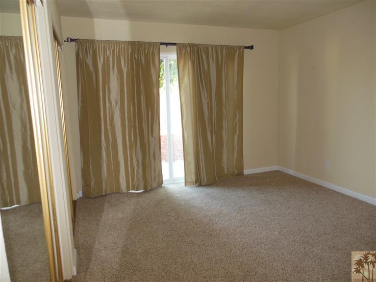 41625 Lima Hall Road Bermuda Dunes, CA 92203 - Photo 6 of 14 an empty room with windows and curtain