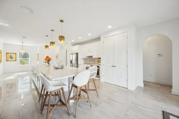 a living room with fireplace furniture and a flat screen tv