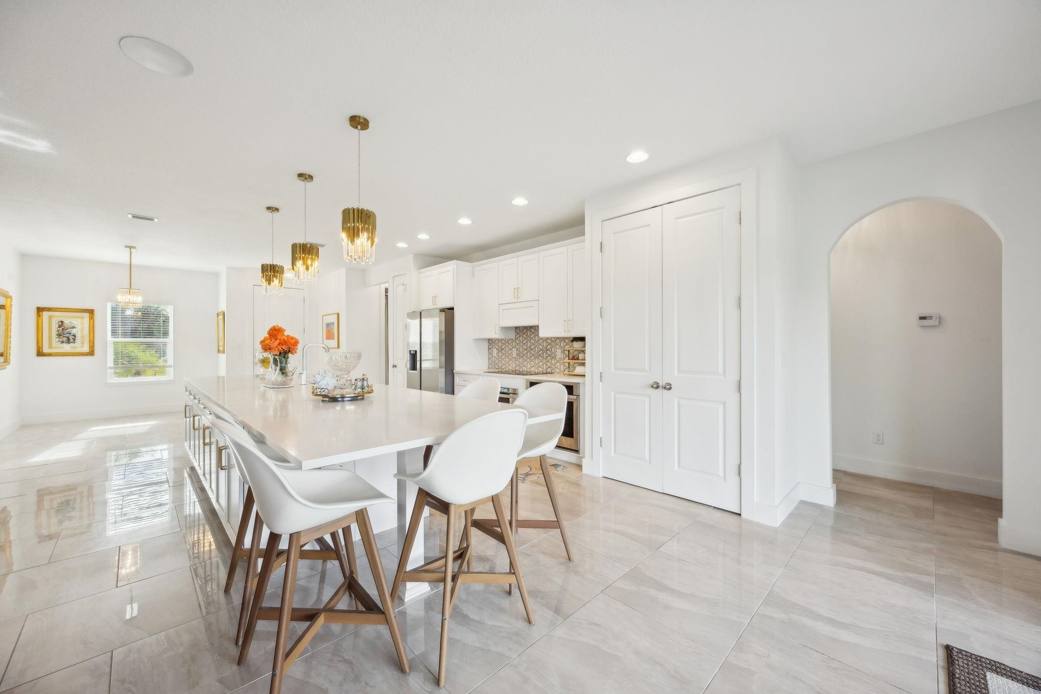 121 Spoonbill Point Court St. Augustine, FL 32080 - Photo 10 of 56 Dining area with arched walkways, recessed lighting, and a chandelier