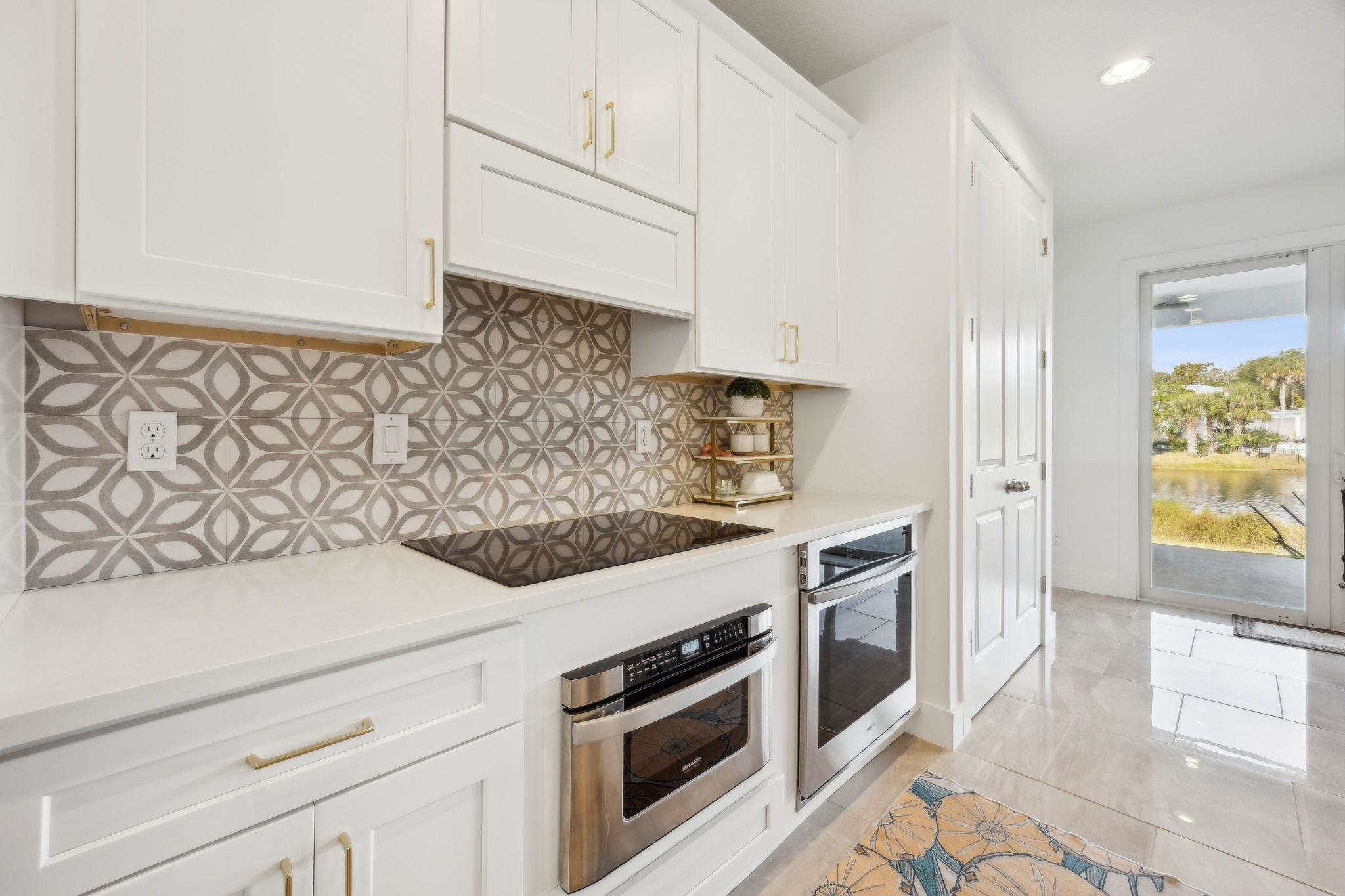 121 Spoonbill Point Court St. Augustine, FL 32080 - Photo 12 of 56 a kitchen with stainless steel appliances granite countertop a sink and a stove