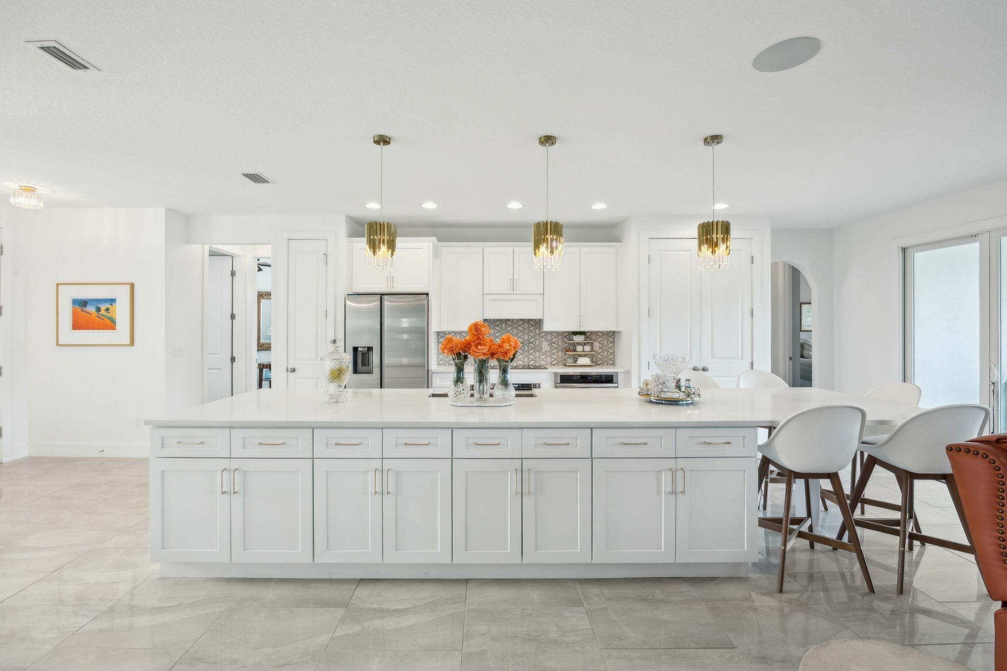 121 Spoonbill Point Court St. Augustine, FL 32080 - Photo 13 of 56 a kitchen with white cabinets and sink