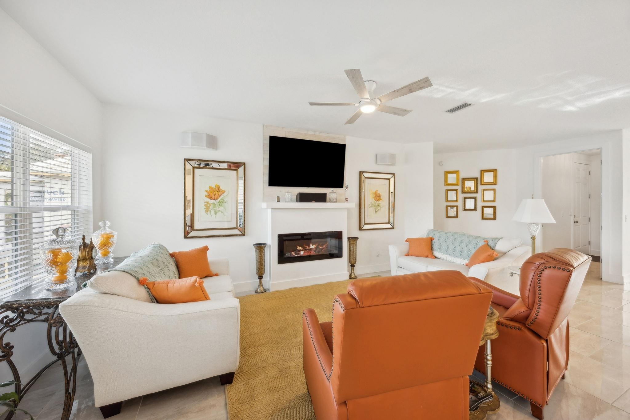 121 Spoonbill Point Court St. Augustine, FL 32080 - Photo 16 of 56 a living room with furniture a fireplace and a flat screen tv
