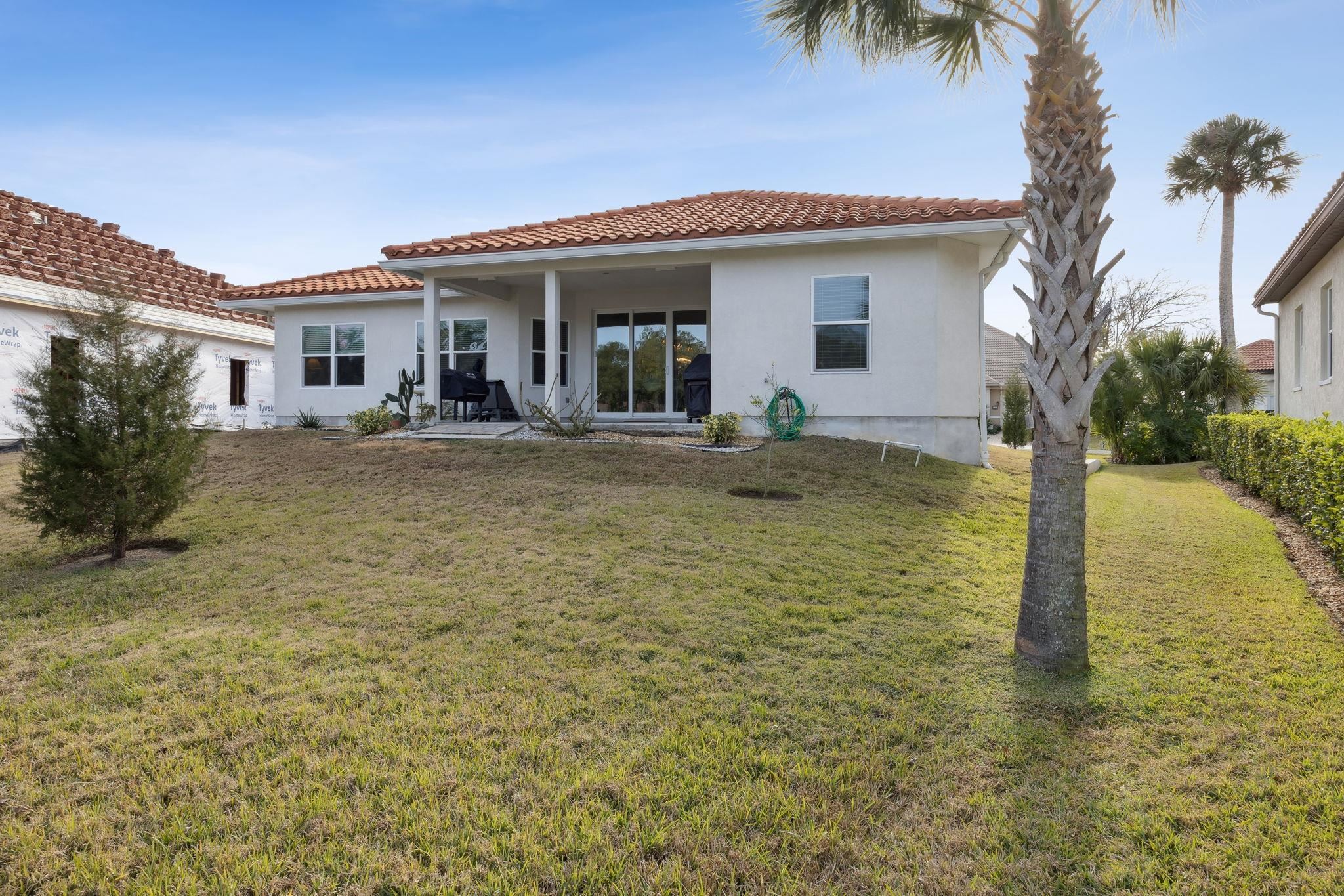 121 Spoonbill Point Court St. Augustine, FL 32080 - Photo 24 of 56 a view of a house with a patio